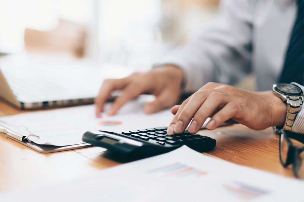 Businessman using calculator