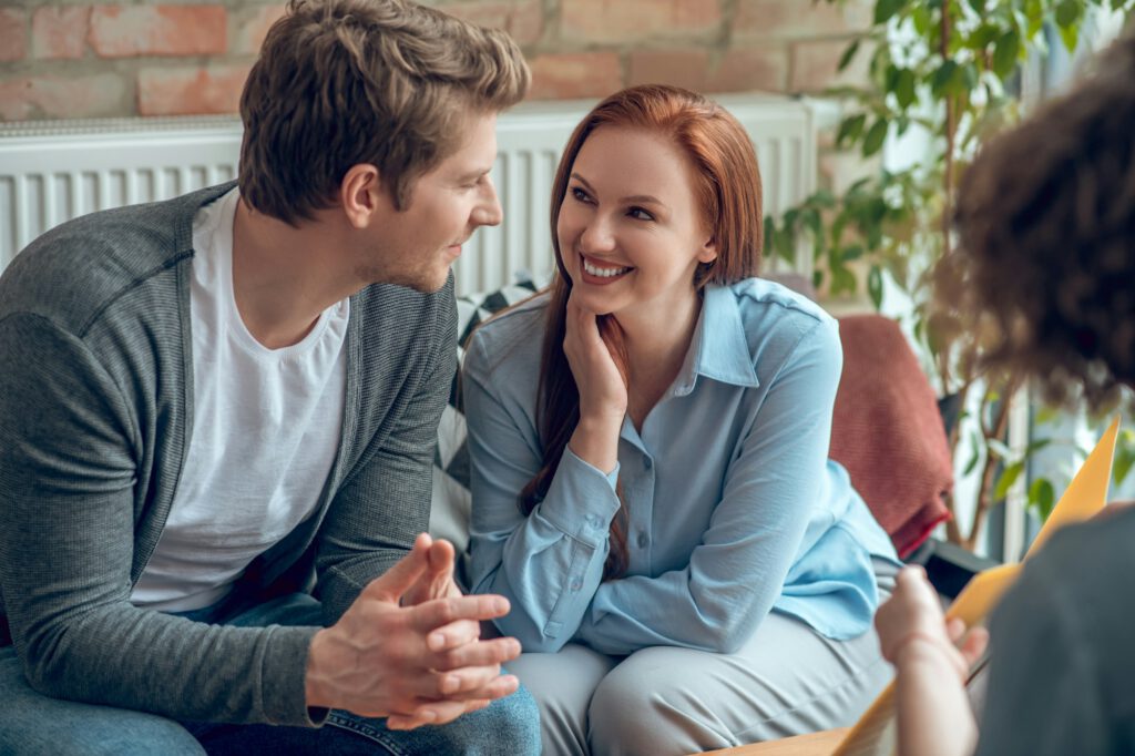 Happy young people buying real estate